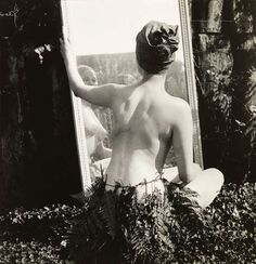 Female nude in fern leaf skirt