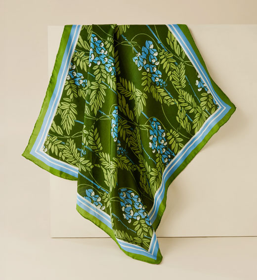 A lightweight silk scarf featuring a wisteria pattern from the V&A archive